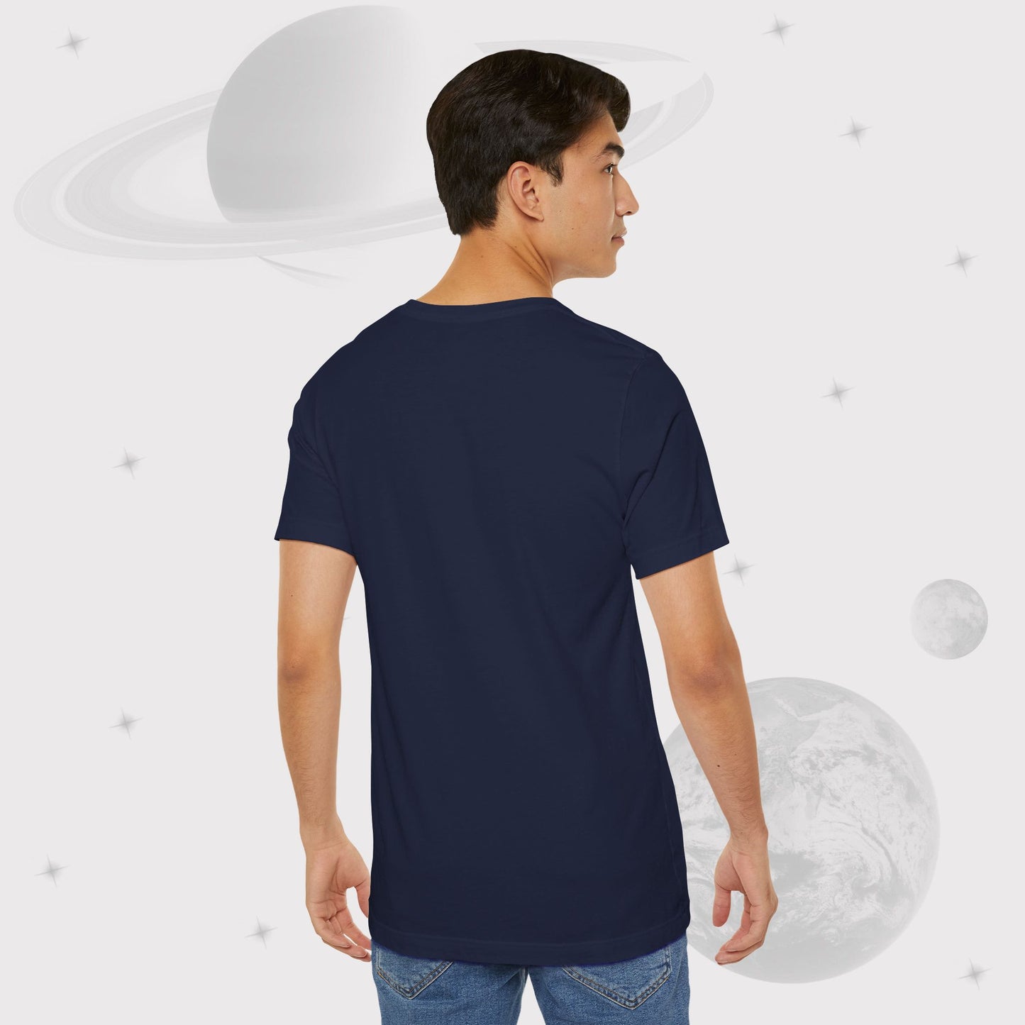 Back side of Man wearing Going Across men's basic t-shirt in navy, featuring the text ‘Universal Citizen’ with space art of vibrant galaxies and planets by Manharleen.