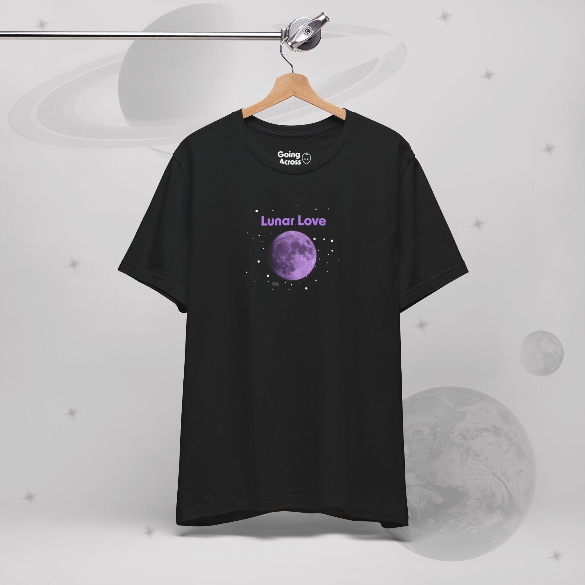 Going Across women's basic t-shirt in black hanging, featuring the text ‘Lunar Love’ with space art of purple lavender full moon by Manharleen.