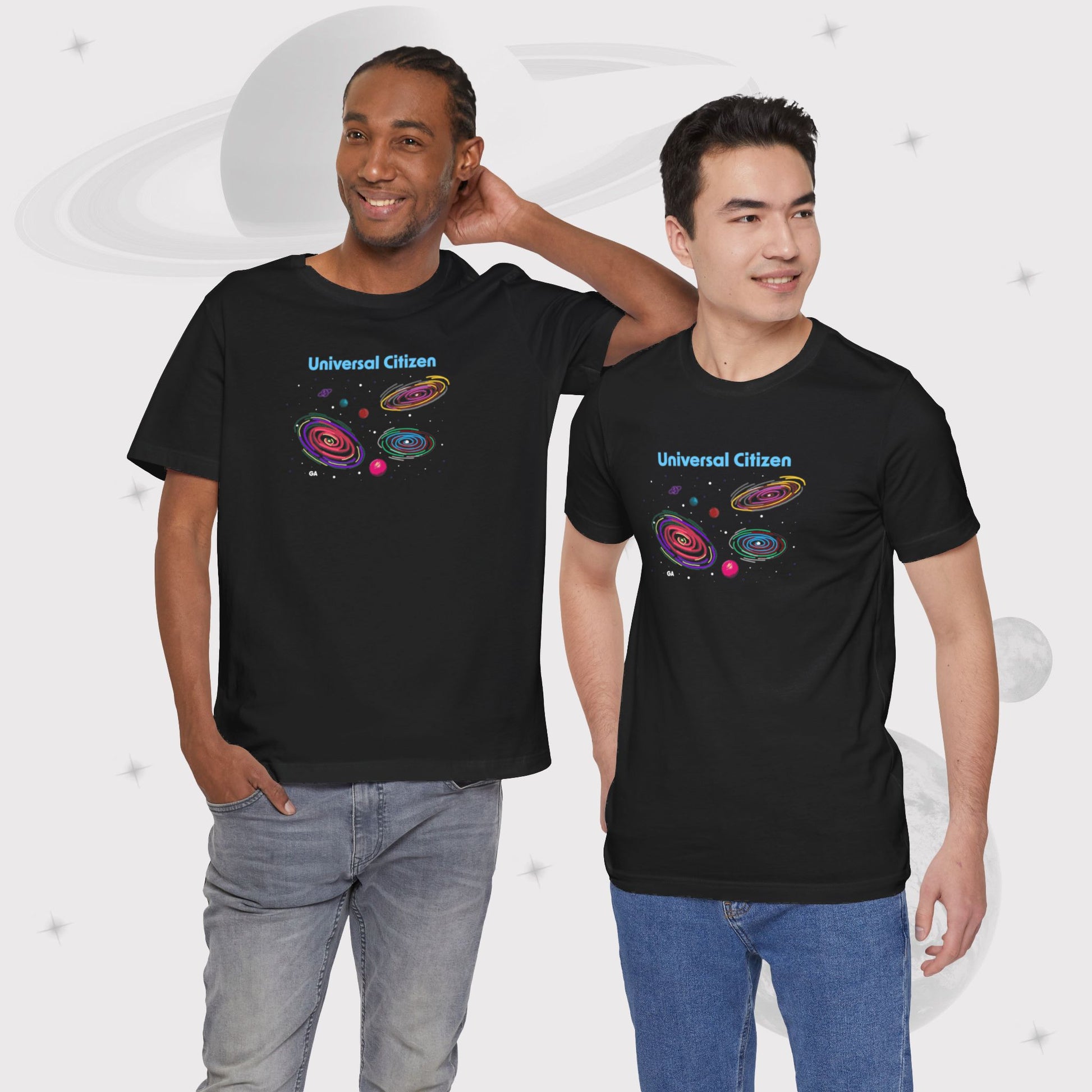 Two men wearing Going Across men's basic t-shirt in black, featuring the text ‘Universal Citizen’ with space art of vibrant galaxies and planets by Manharleen.