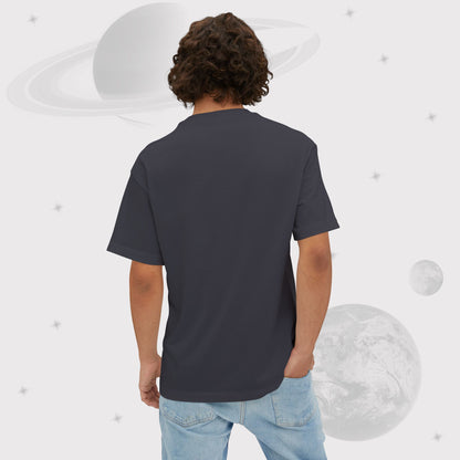 Back side of man wearing Going Across men's oversized boxy t-shirt in dark grey, featuring the text ‘UFO HOTLINE’ space art by Manharleen.