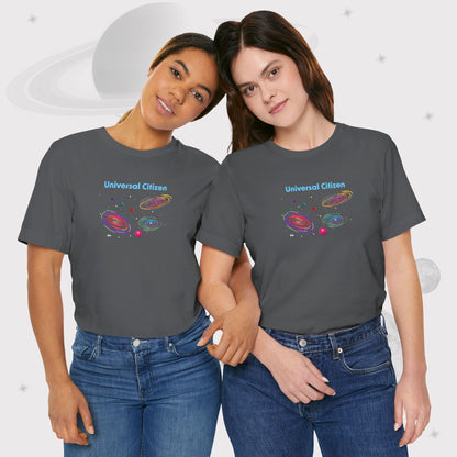 Two women wearing Going Across women's basic t-shirt in asphalt/gray, featuring the text ‘Universal Citizen’ with space art of vibrant galaxies and planets by Manharleen.