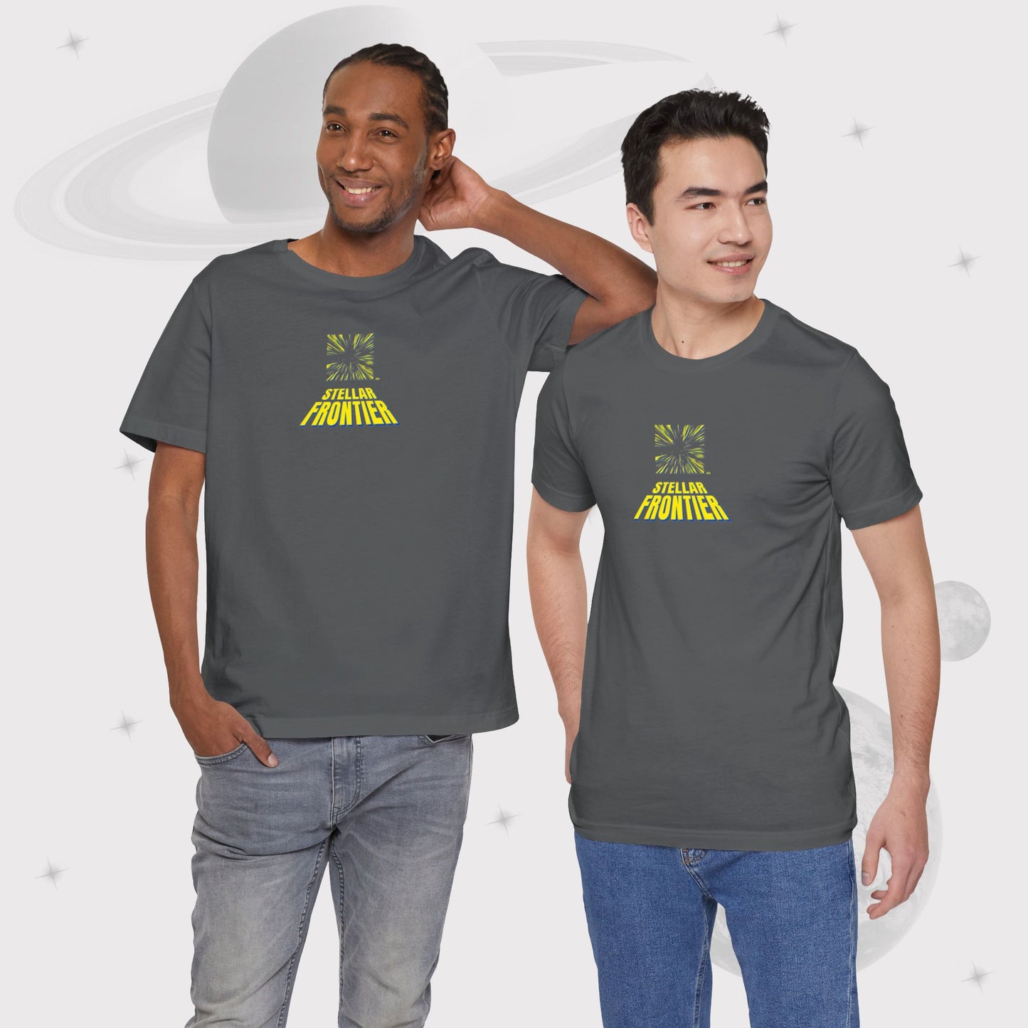 Two men wearing Going Across men's basic t-shirt in grey/asphalt, with jeans, featuring the text ‘Stellar Frontier’ and vibrant yellow, deep blue space art by Manharleen.