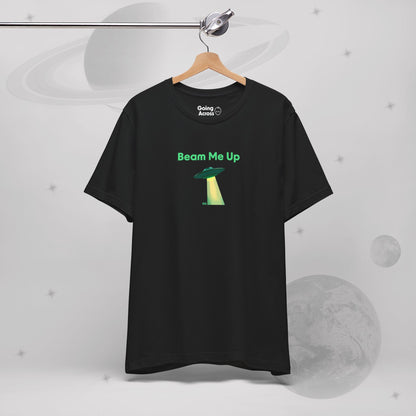 Going Across men's basic t-shirt in black, hanging, featuring the text ‘Beam Me Up’ and space art of ufo in celestial green by Manharleen.