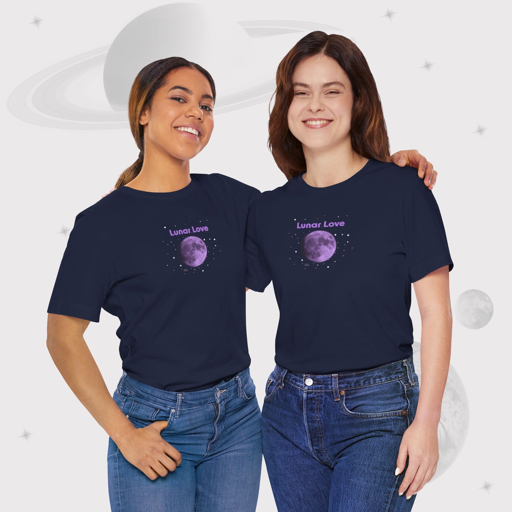 Two women wearing Going Across women's basic t-shirt in navy, featuring the text ‘Lunar Love’ with space art of purple lavender full moon by Manharleen.