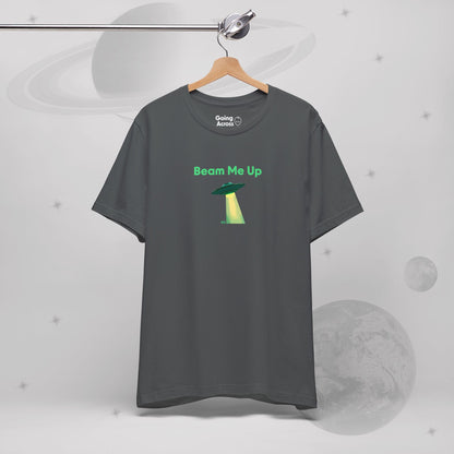 Going Across men's basic t-shirt in asphalt/grey, hanging, featuring the text ‘Beam Me Up’ and space art of ufo in celestial green by Manharleen.