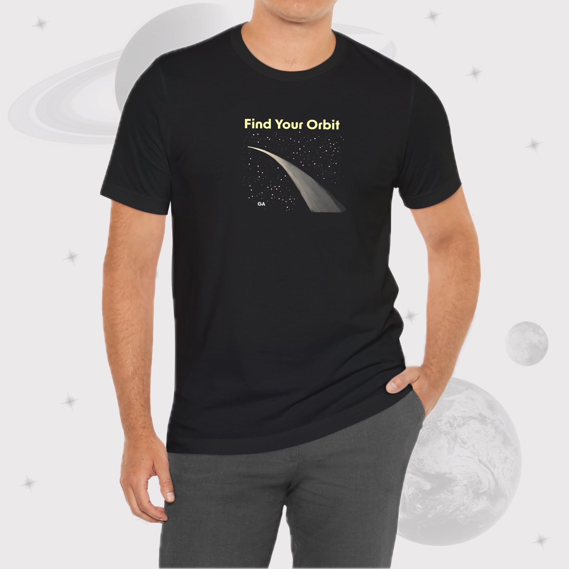 Man wearing Going Across men's basic t-shirt in black, featuring the text ‘Find Your Orbit’ and space art of an orbit and a starry sky by Manharleen.