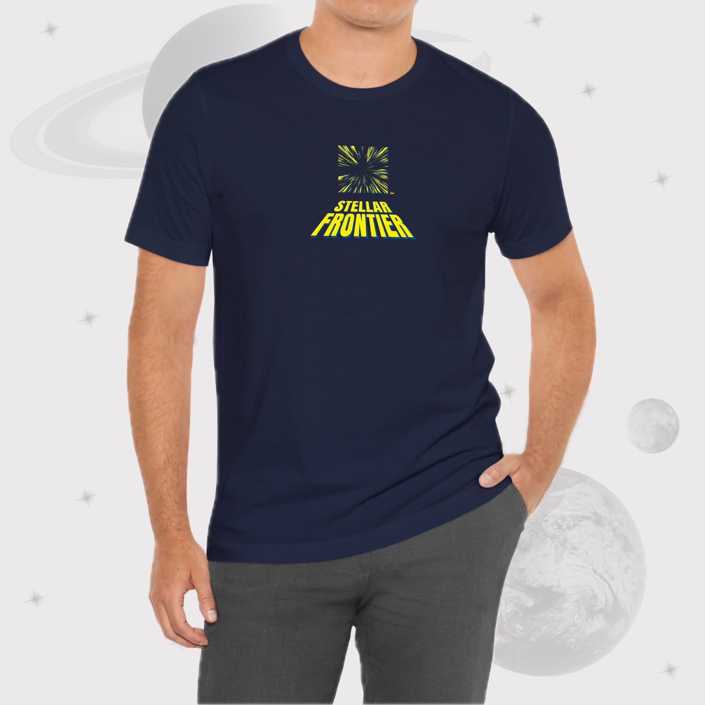 Man wearing Going Across men's basic t-shirt in navy, with jeans, featuring the text ‘Stellar Frontier’ and vibrant yellow, deep blue space art by Manharleen.