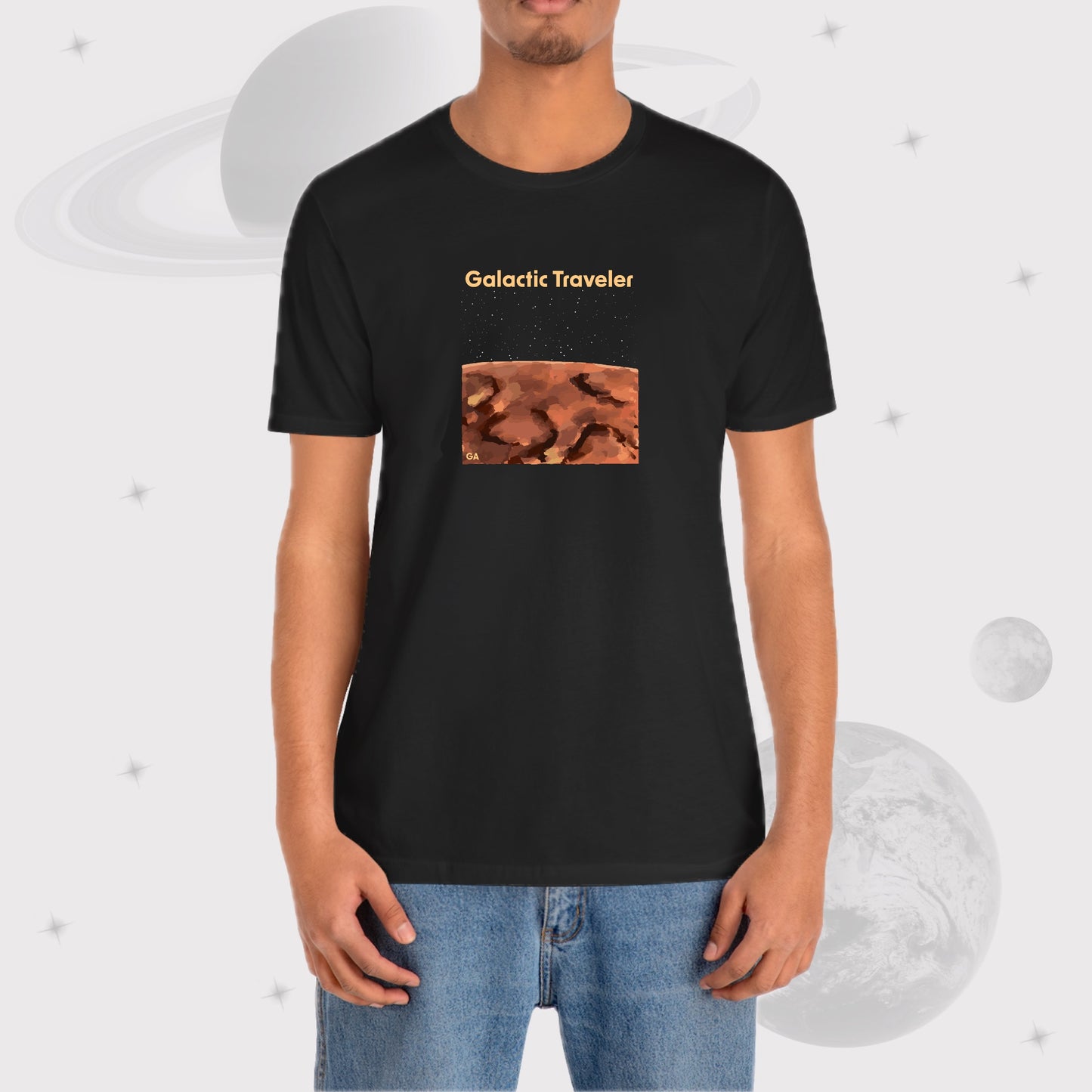 Man wearing Going Across men's basic t-shirt in black, featuring the text ‘Galactic Traveler’ and space art of a red planet and a starry sky by Manharleen.