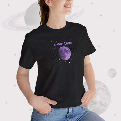 Woman wearing Going Across women's basic t-shirt in black, featuring the text ‘Lunar Love’ with space art of purple lavender full moon by Manharleen.