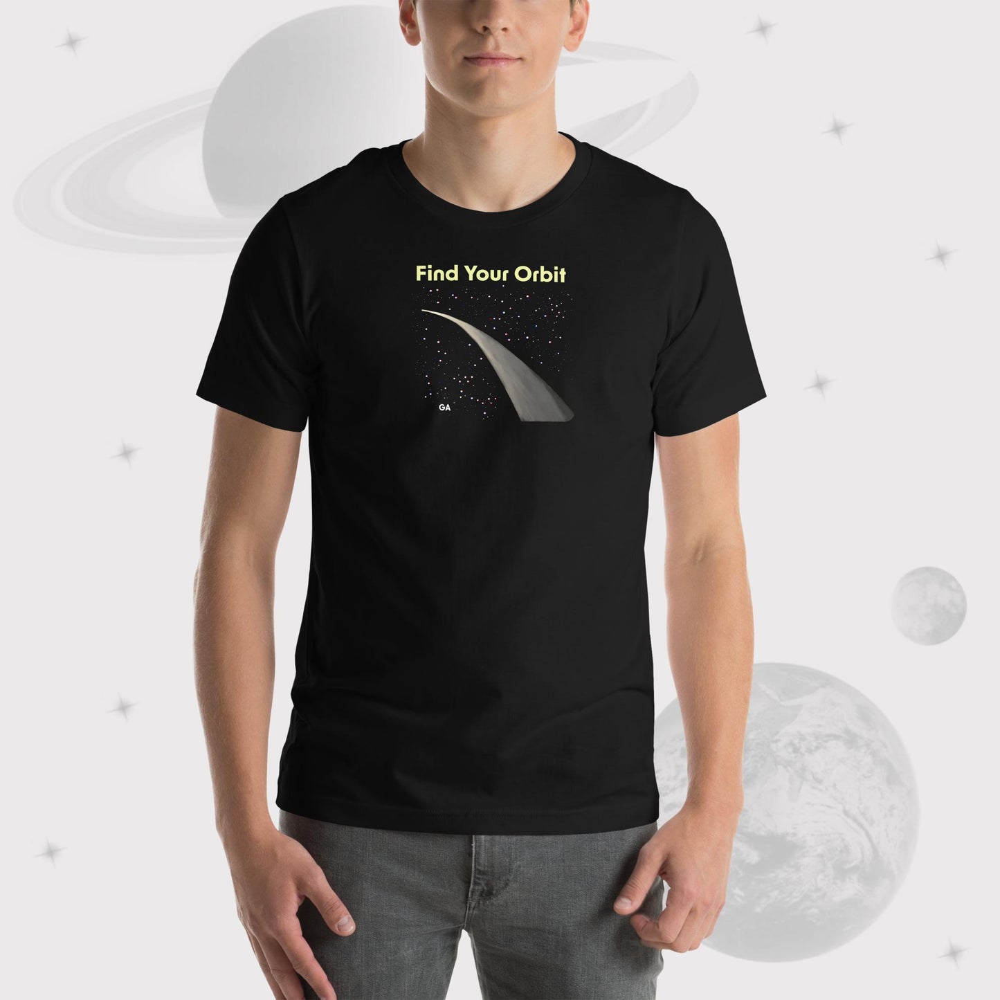 Zoom in of Man wearing Going Across men's basic t-shirt in black, featuring the text ‘Find Your Orbit’ and space art of an orbit and a starry sky by Manharleen.