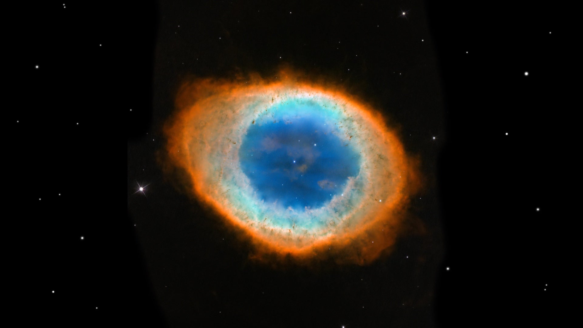 Vibrant orange and blue eye nebula against a starry background, ideal inspiration for 'Going Across' apparel.